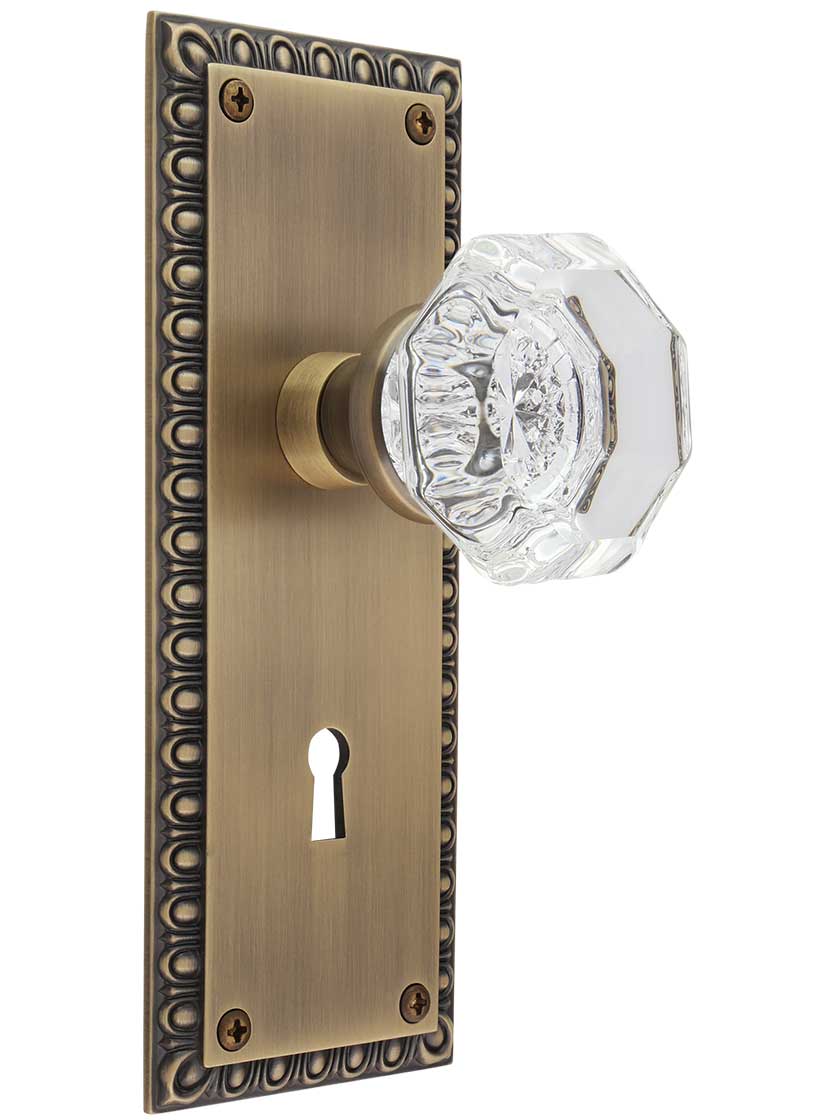 Ovolo Mortise-Lock Set with Waldorf Crystal Glass Knobs in Antique Brass.
